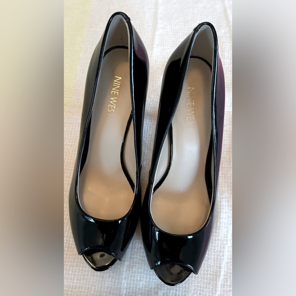 Nine West black patent leather peep toe heels.